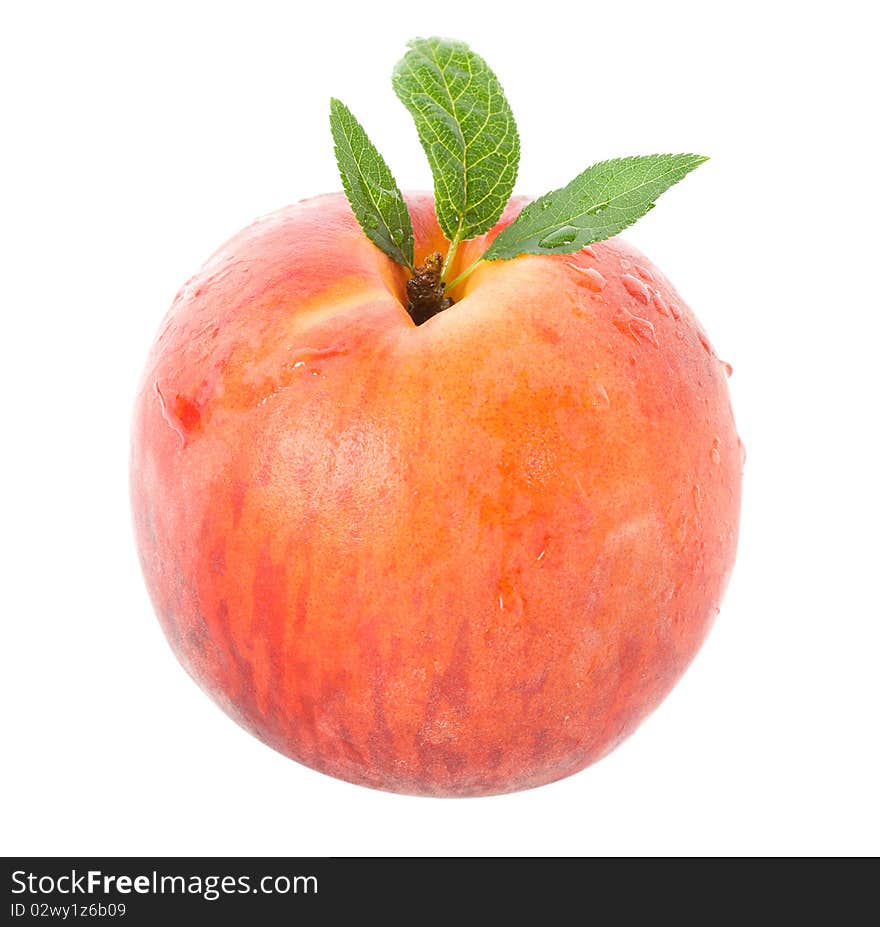 Ripe peach with leaves