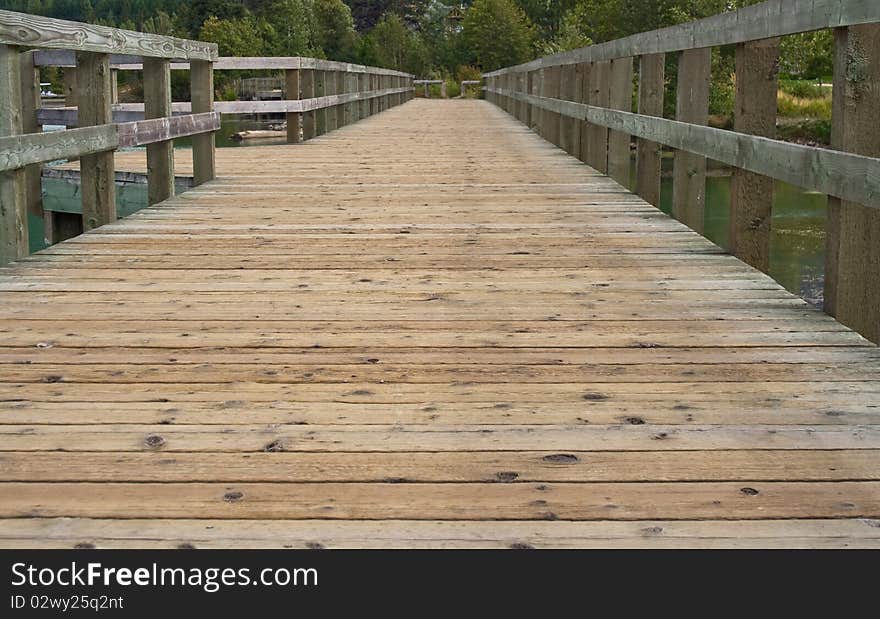 Abstract view showing perspective of a bridge over the pond in the park