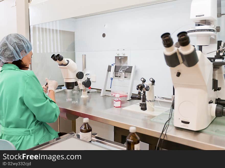 Woman in the form of health worker conducting a study in the laboratory. Woman in the form of health worker conducting a study in the laboratory