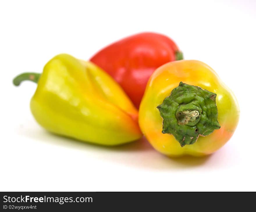 Colorful fresh peppers isolated on white background