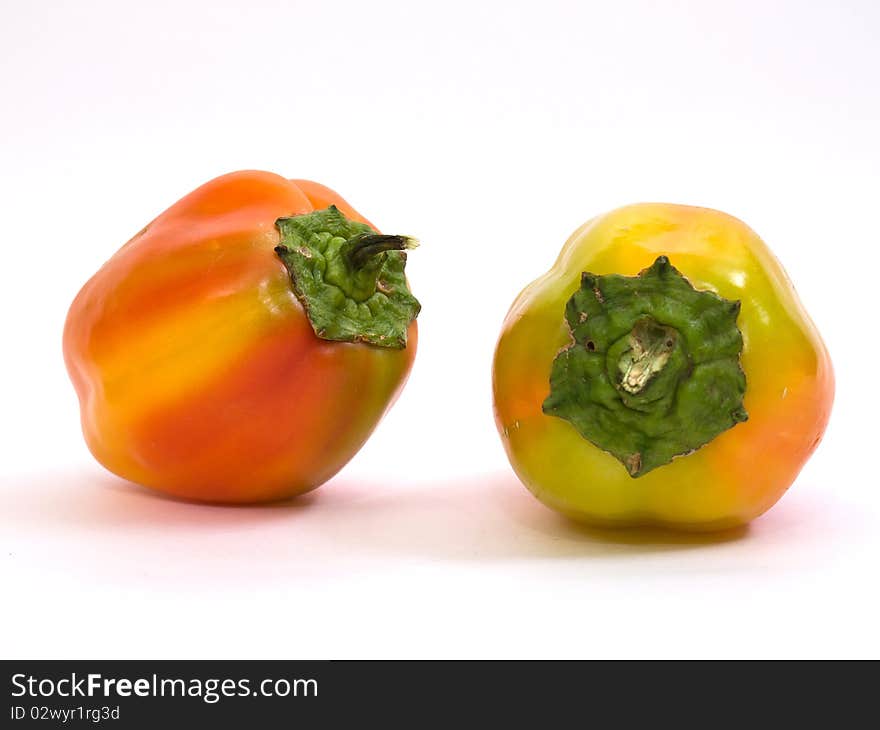 Colorful fresh peppers isolated on white background