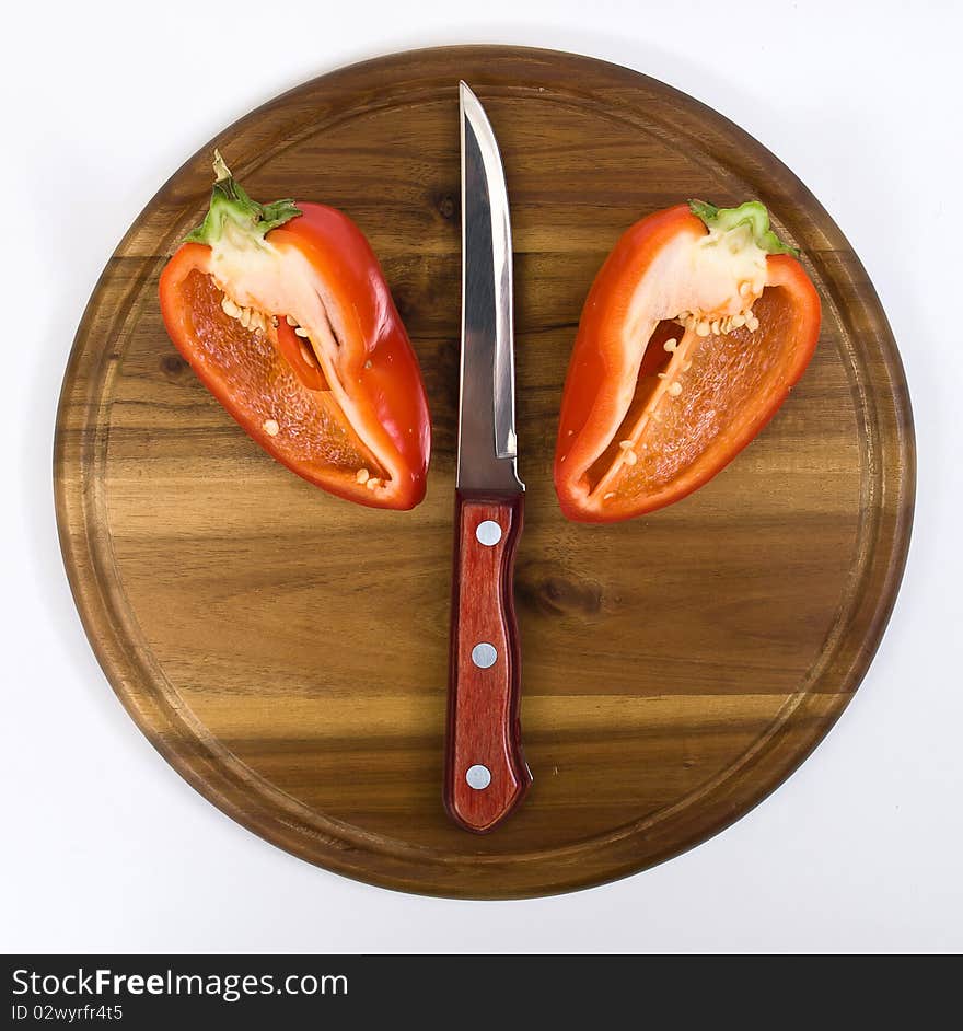 Red pepper on wooden kitchen board