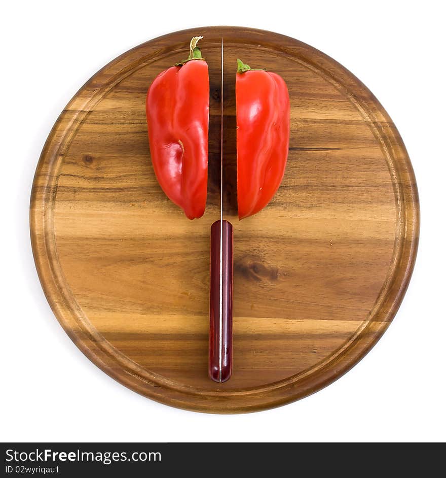 Red Pepper On Kitchen Board With Knife