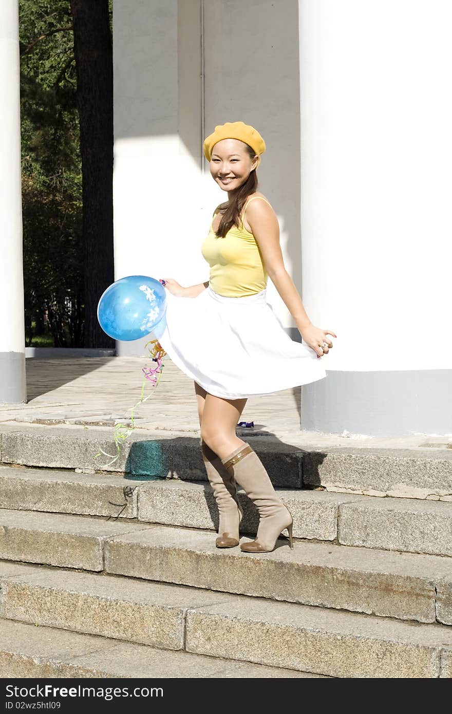 Girl dancing with balloon