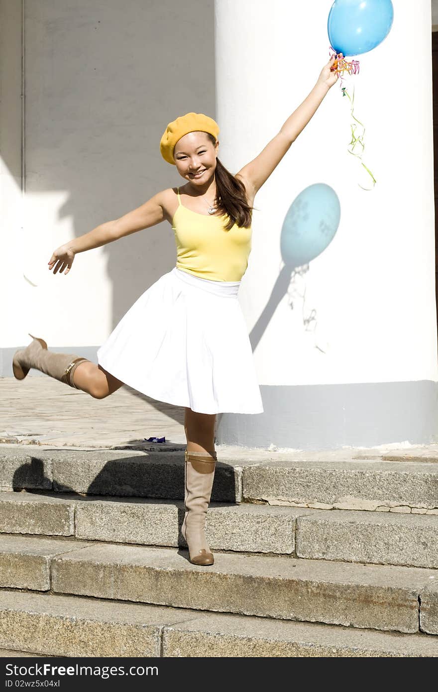 Girl dancing with baloon