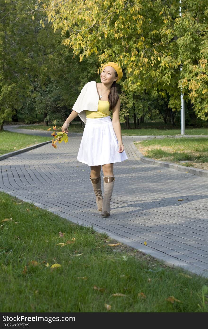 Girl walking in autumn park. Girl walking in autumn park