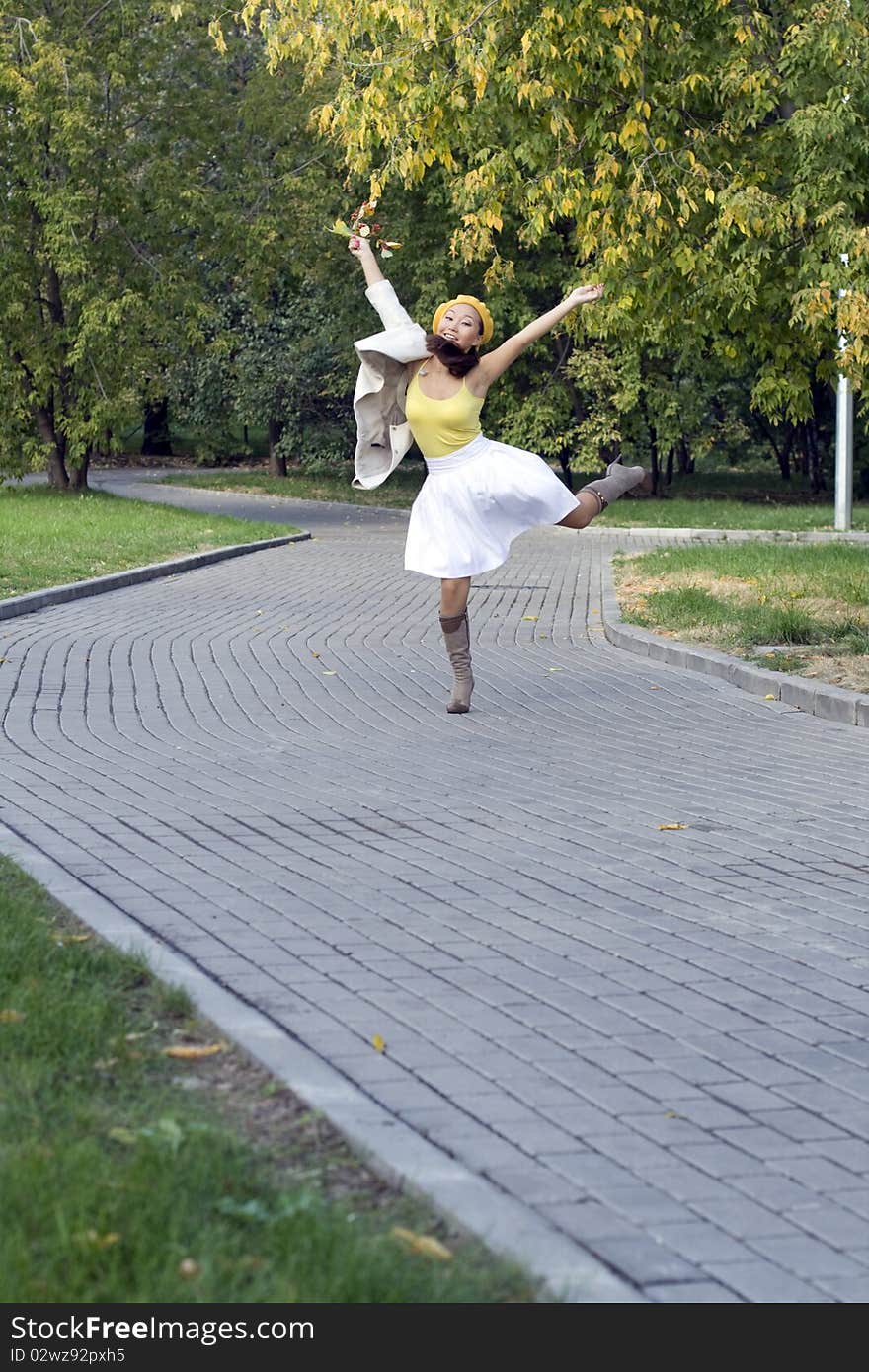 Girl walking in autumn park. Girl walking in autumn park