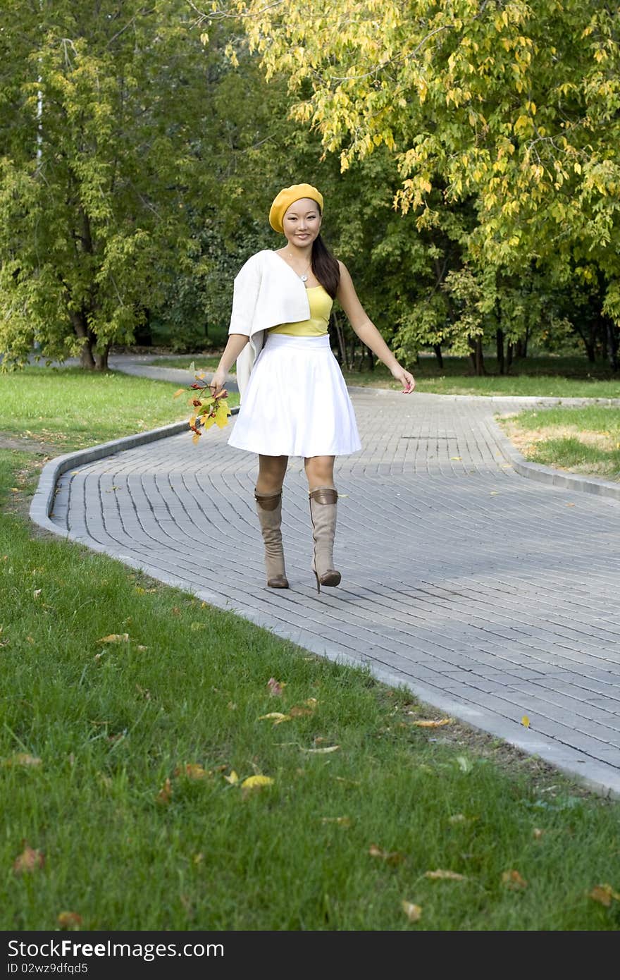 Girl walking in autumn park. Girl walking in autumn park