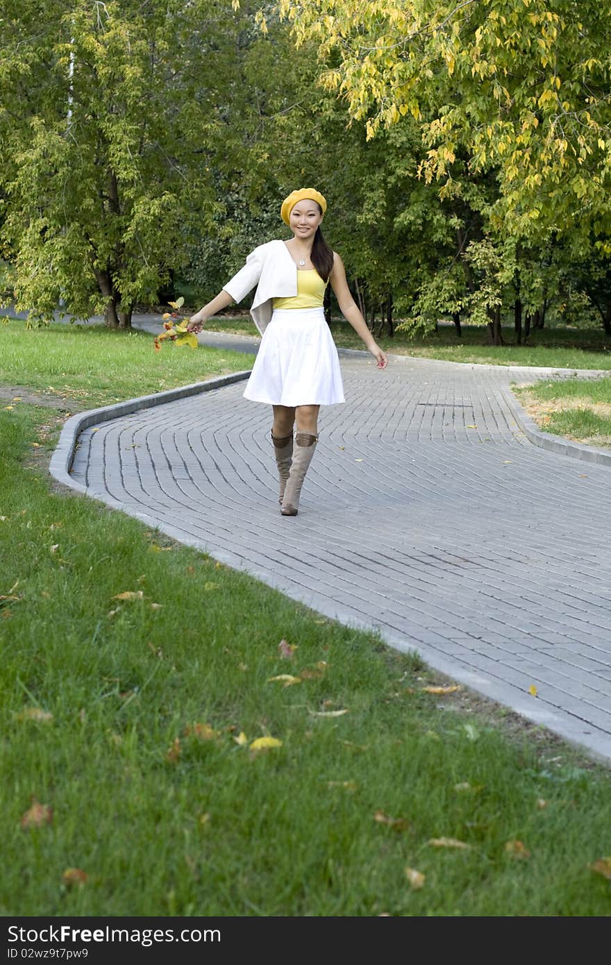 Girl walking in autumn park. Girl walking in autumn park