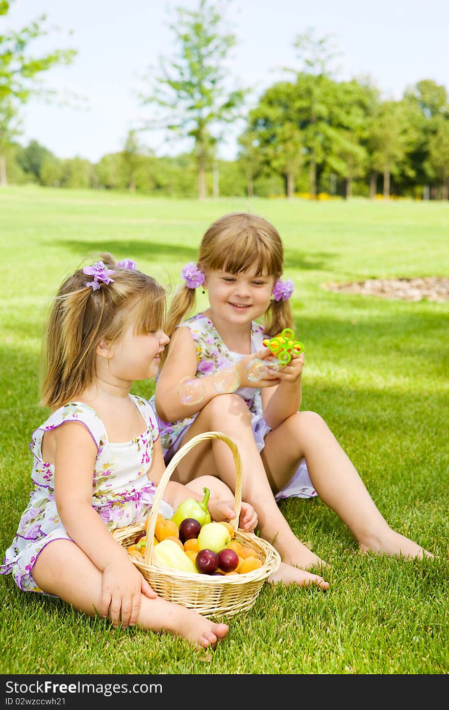 Preschool sisters in garden