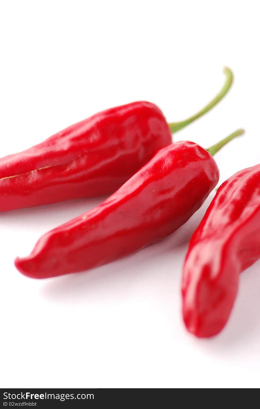 Red hot chili peppers on a white