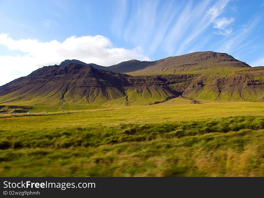 Green mountain with blue sky streaked. Green mountain with blue sky streaked