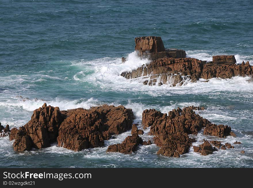 Rocks in the sea off the coast of Guernsey