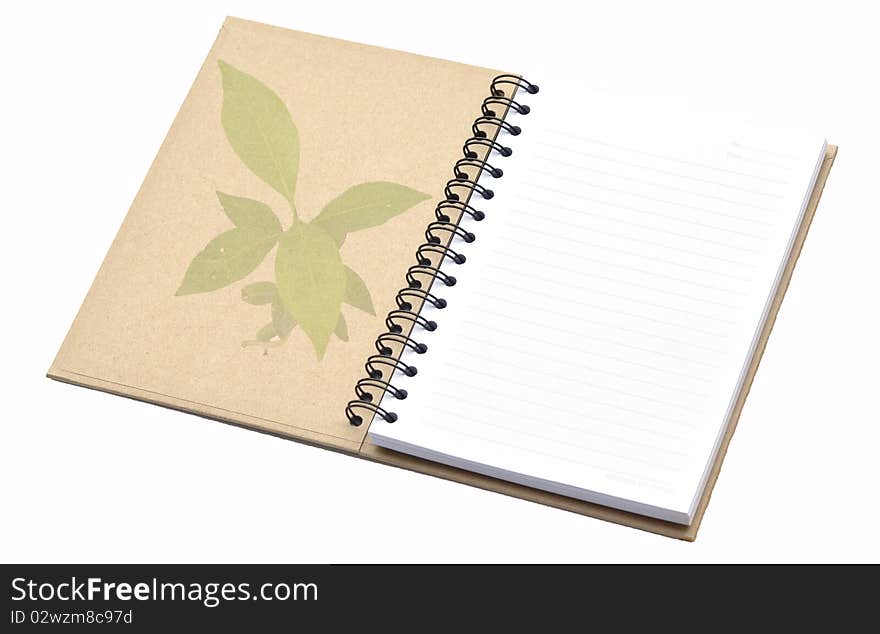 Recycle notebook with tree pattern on cover.