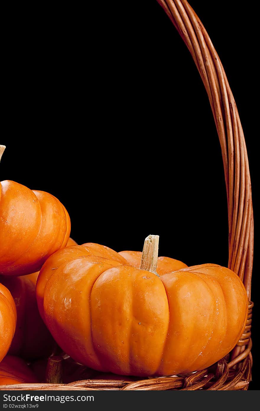 Small orange pumpkins symbolising autumn holidays and used in decorative works.