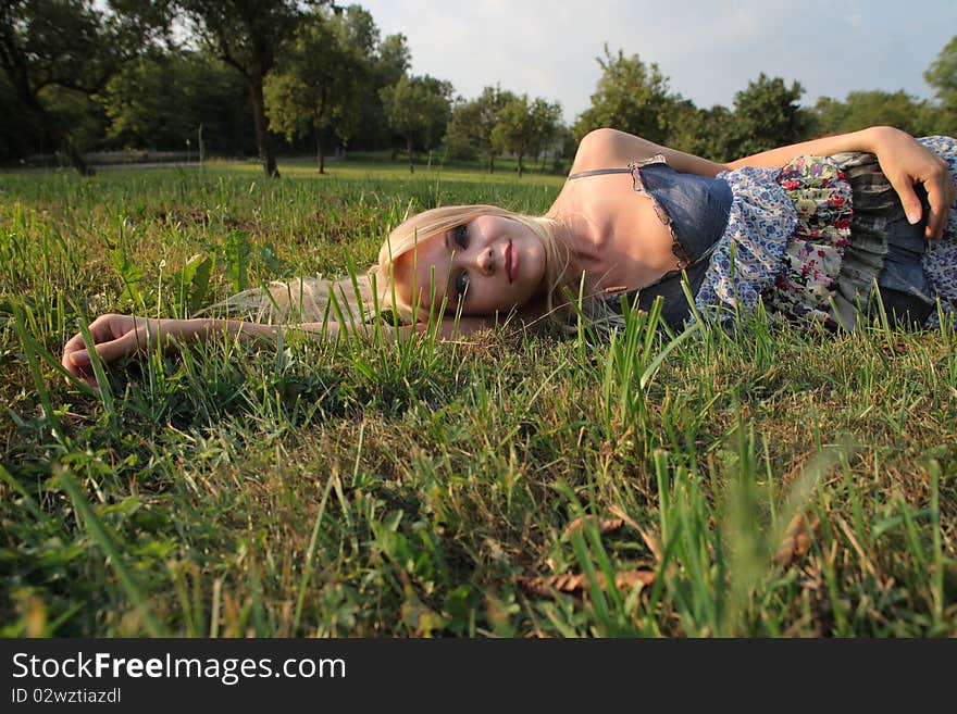 Beautiful woman lying on a green meadow. Beautiful woman lying on a green meadow