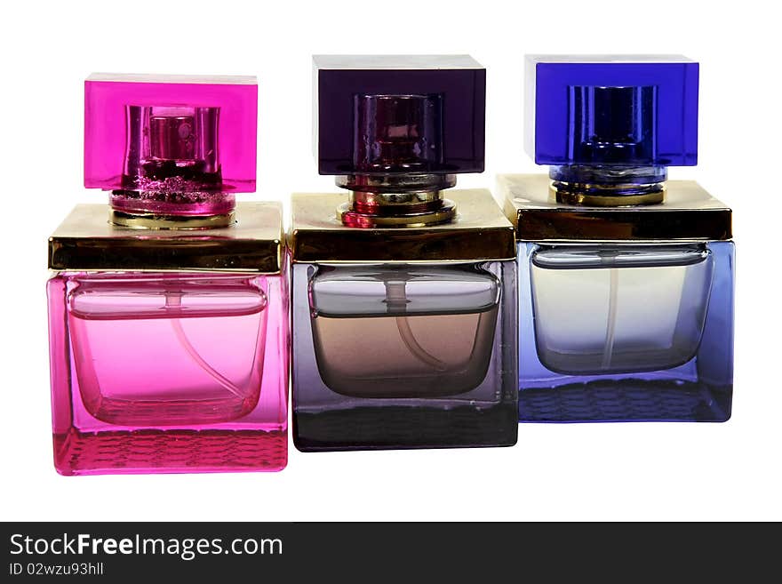 Three bottles of perfume on a white background.