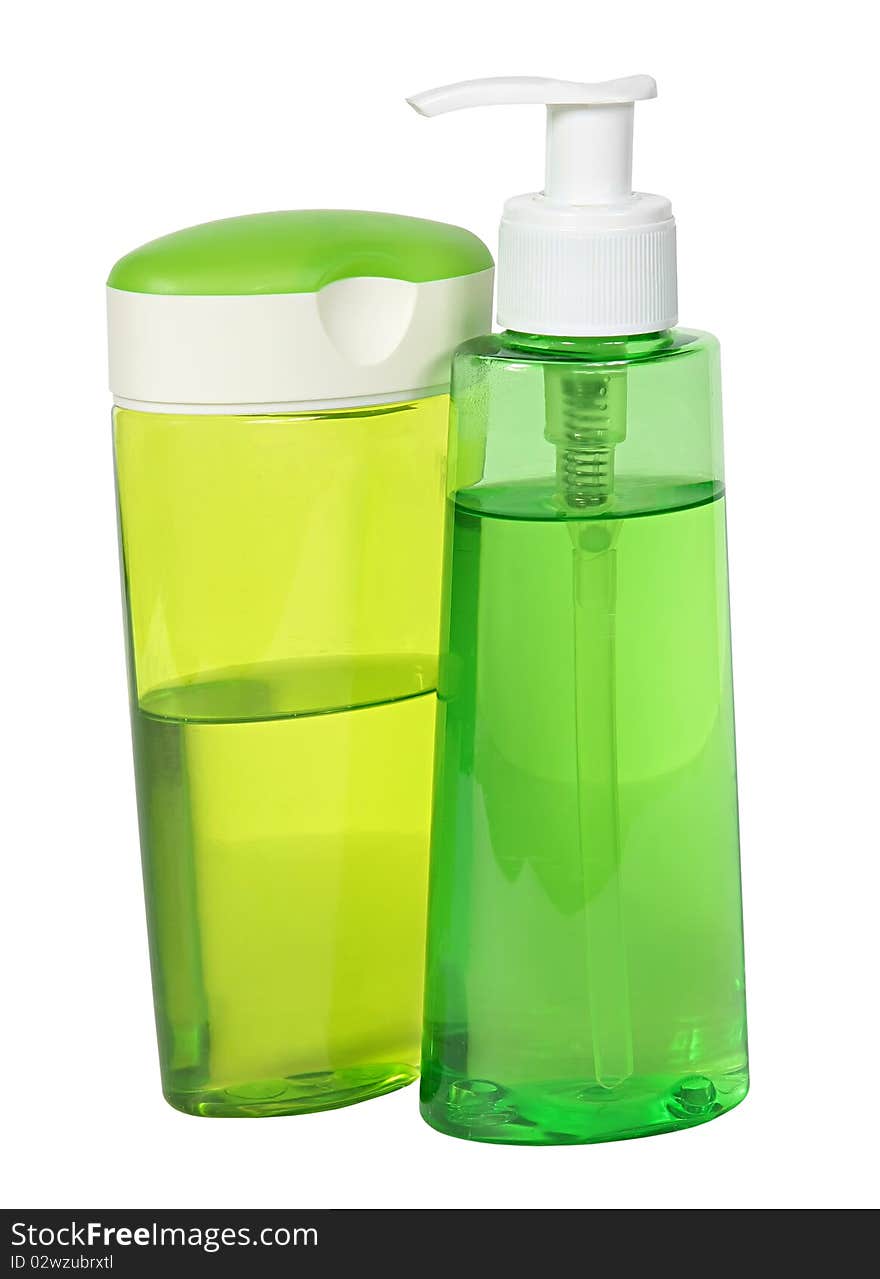 Two green plastic bottles isolated on a white background