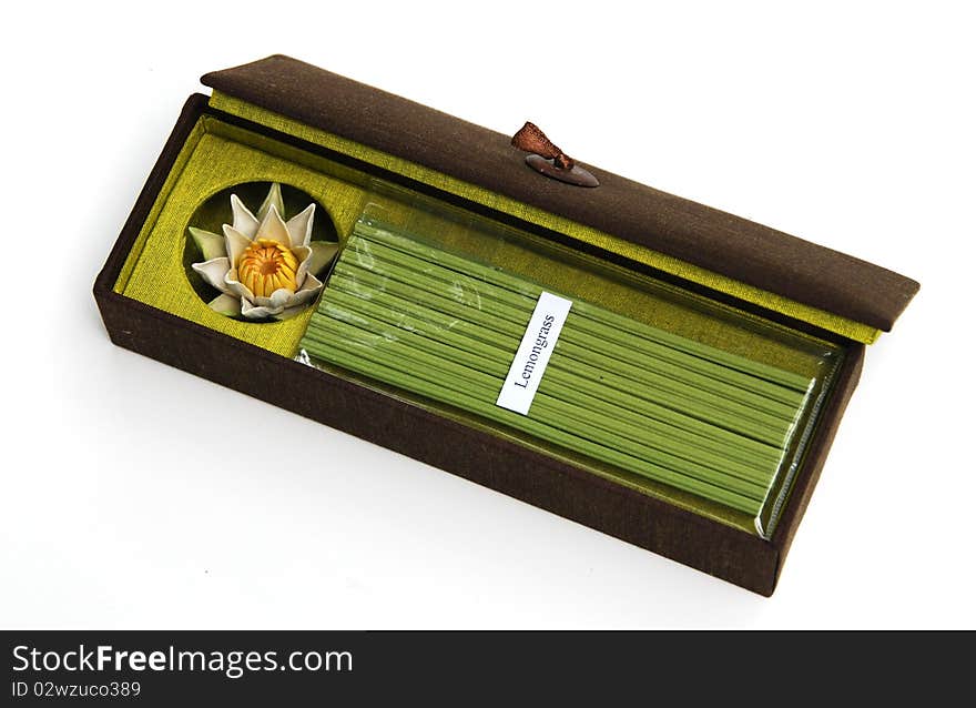 Incense and ceramic lotus incense holder in gift box on white background. Incense and ceramic lotus incense holder in gift box on white background