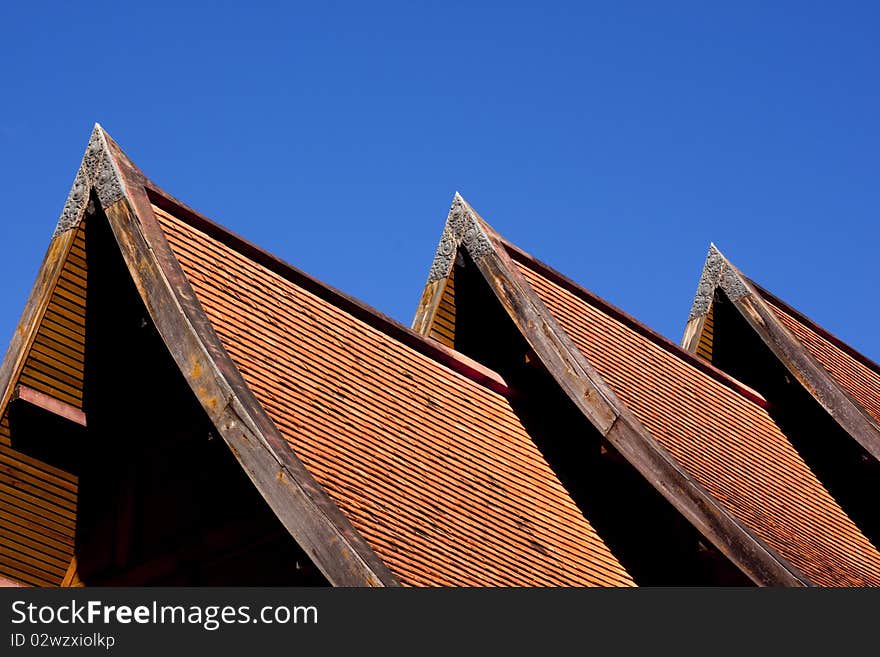 Three Orange tile roof