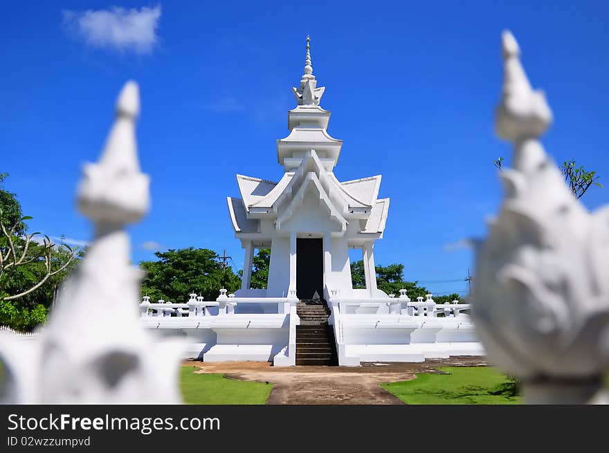 Pavilion of Wat Rong Khun temple against blue sky