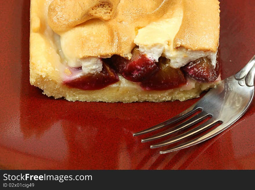 Closeup of plum cake with meringue coat. Closeup of plum cake with meringue coat