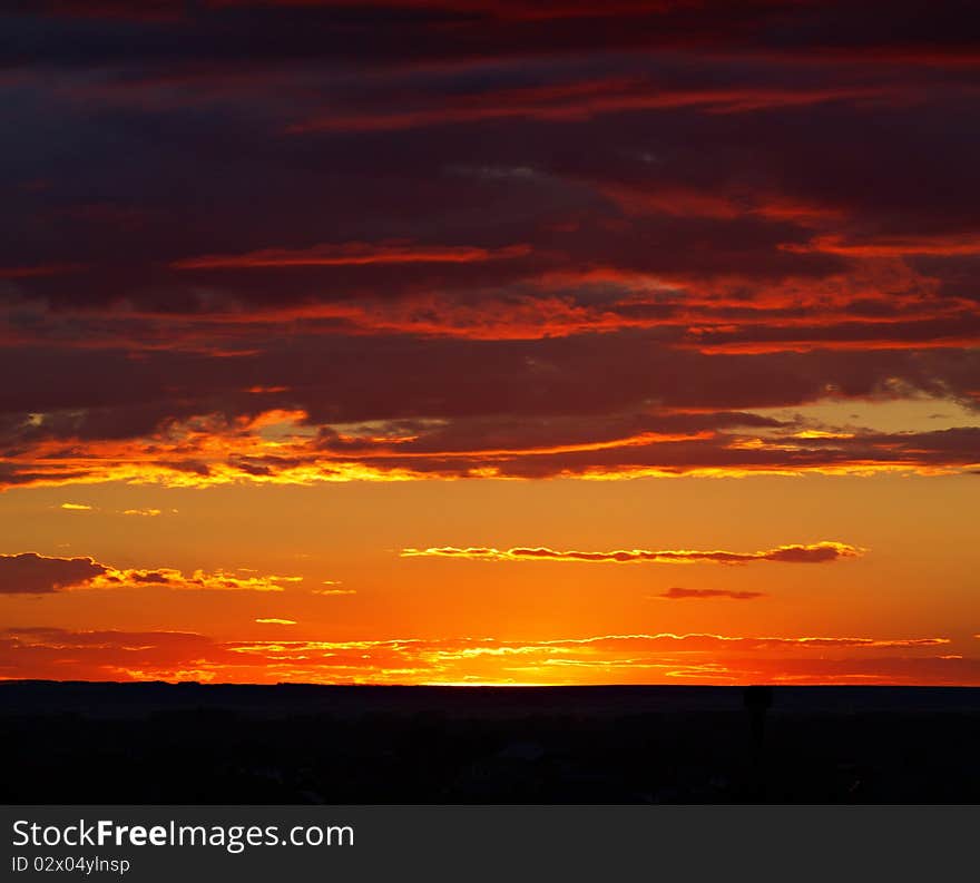 Very beautiful sunset. The sun peeps out from behind the clouds. Very beautiful sunset. The sun peeps out from behind the clouds.