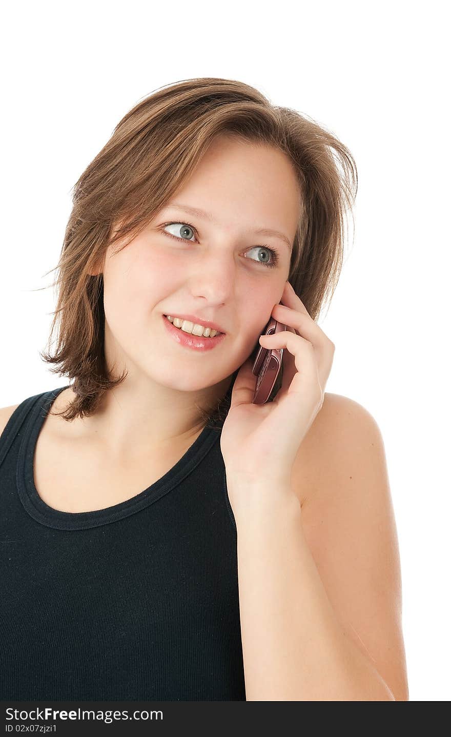 Woman talking on her mobile phone - isolated over a white background. Woman talking on her mobile phone - isolated over a white background