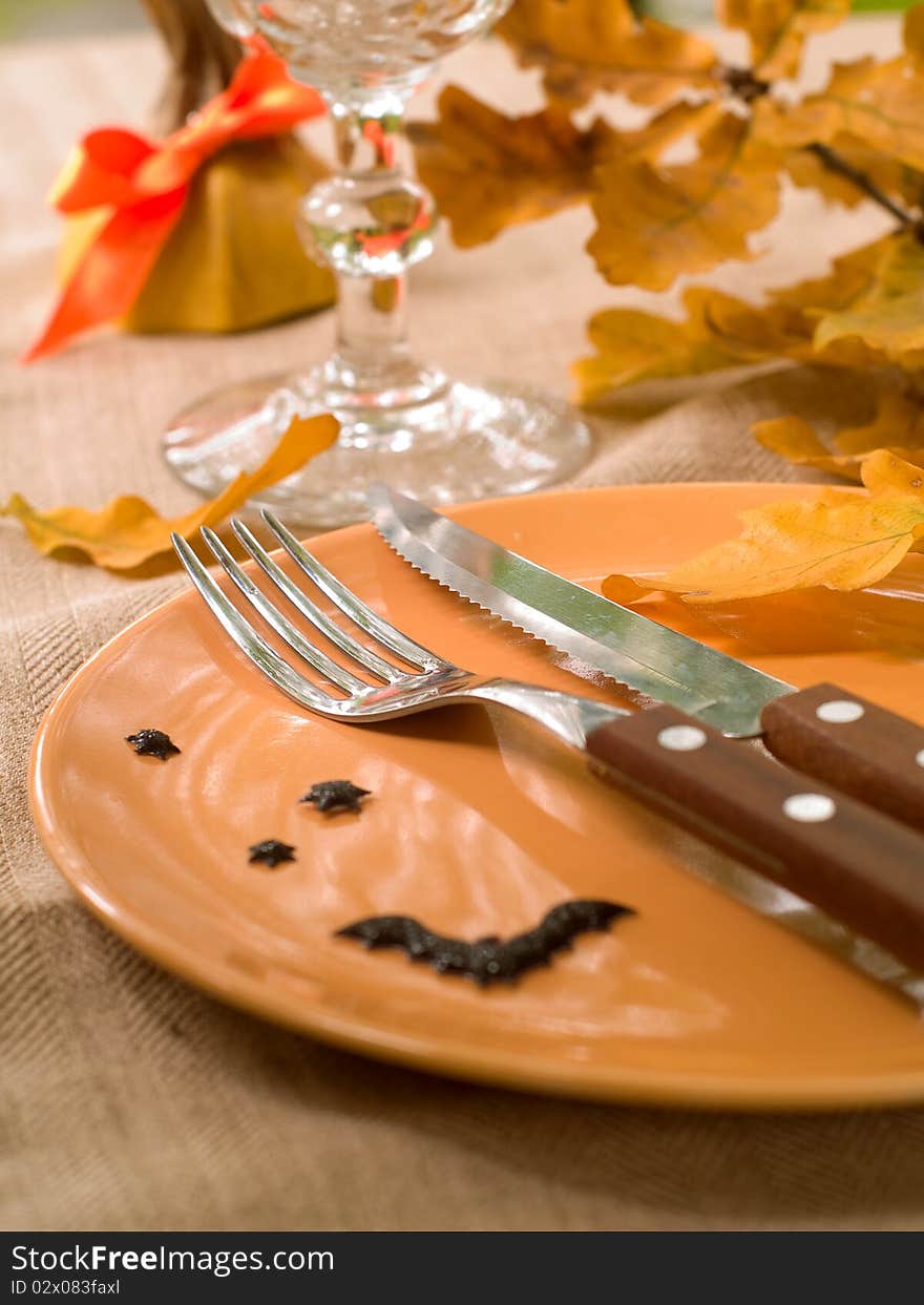 Knife and fork on empty plate,decoration for Halloween. Knife and fork on empty plate,decoration for Halloween