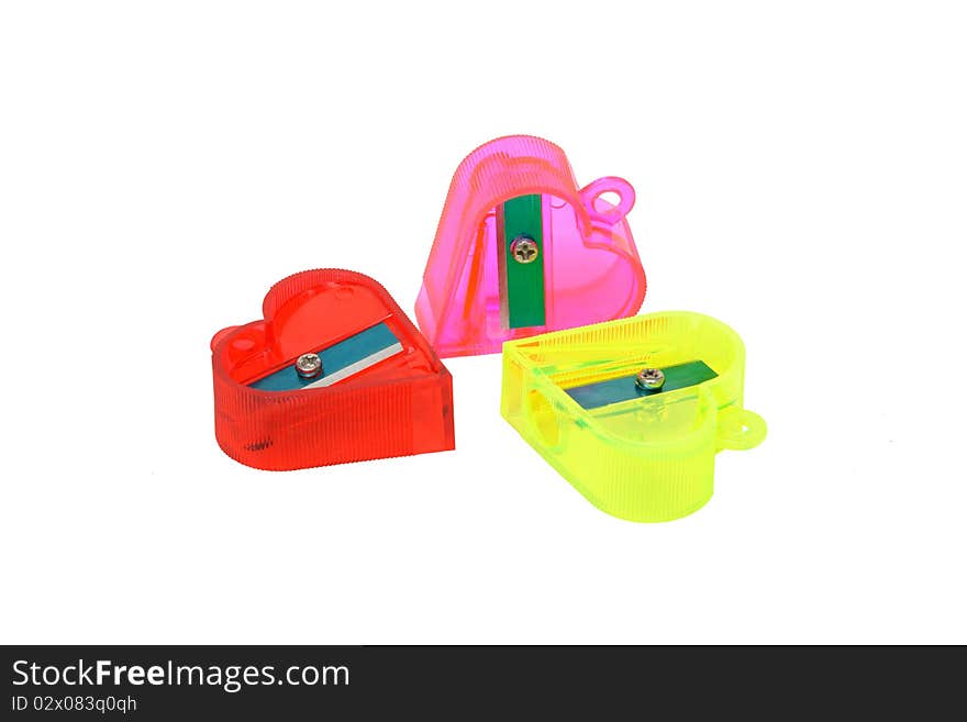 Three translucent plastic sharpeners isolated on a white background. Clipping path included.