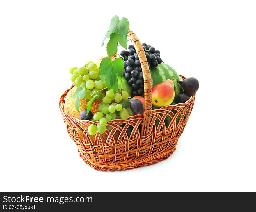 Ripe fruits in the basket isolated on white. Ripe fruits in the basket isolated on white