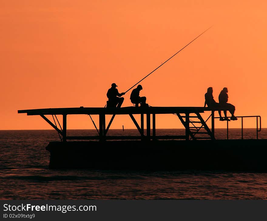 Fishermen on Black Sea at sunset, Sochi