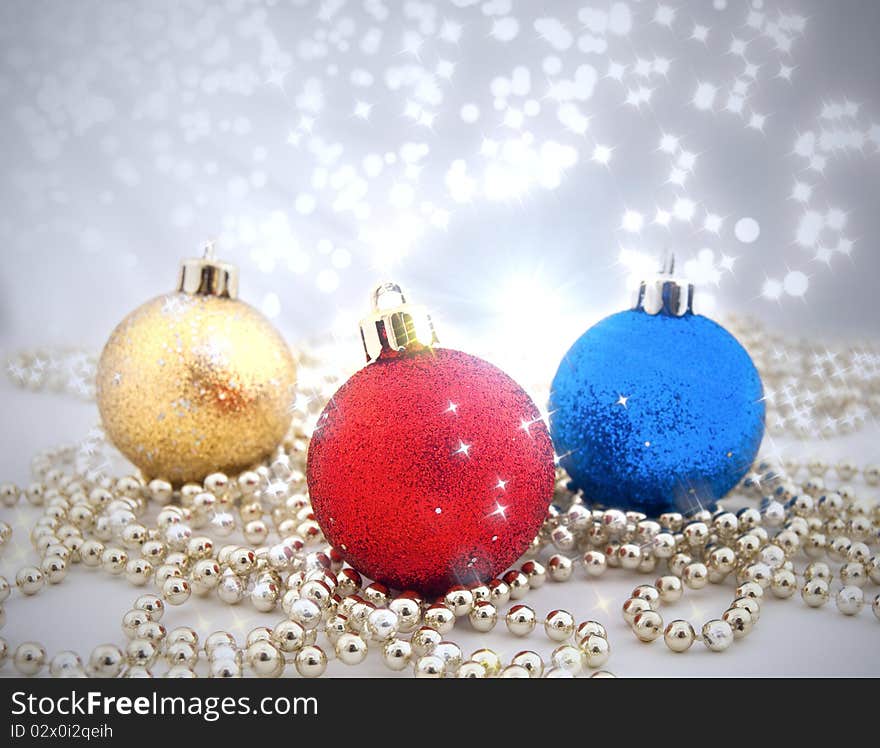 Sparkling Christmas decorations with a background from a bokeh and sparks