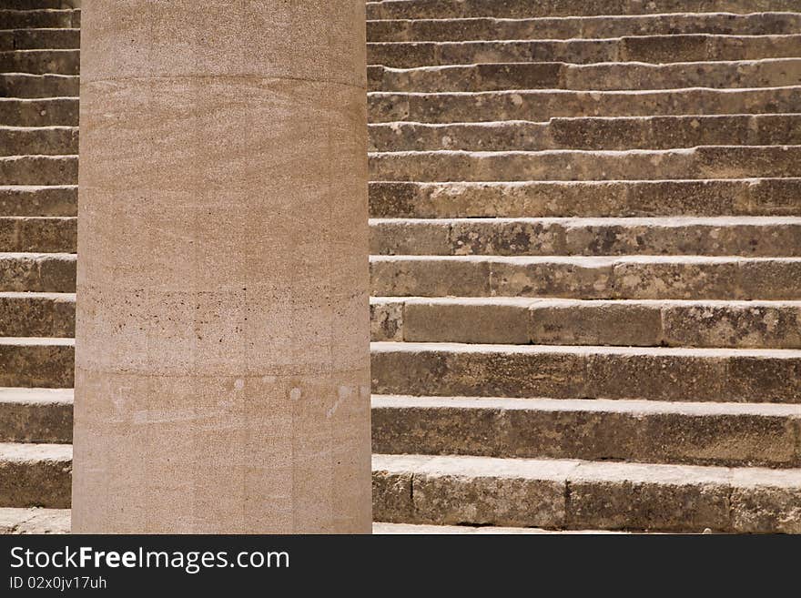 Close-up of the main stairs and a doric column in the Acropolis of Lindos, on the Greek island of Rhodes. Close-up of the main stairs and a doric column in the Acropolis of Lindos, on the Greek island of Rhodes.