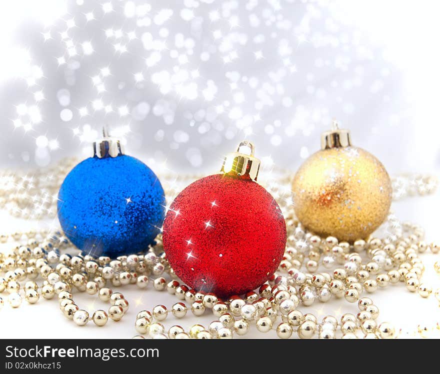 Sparkling Christmas decorations with a background from a bokeh and sparks