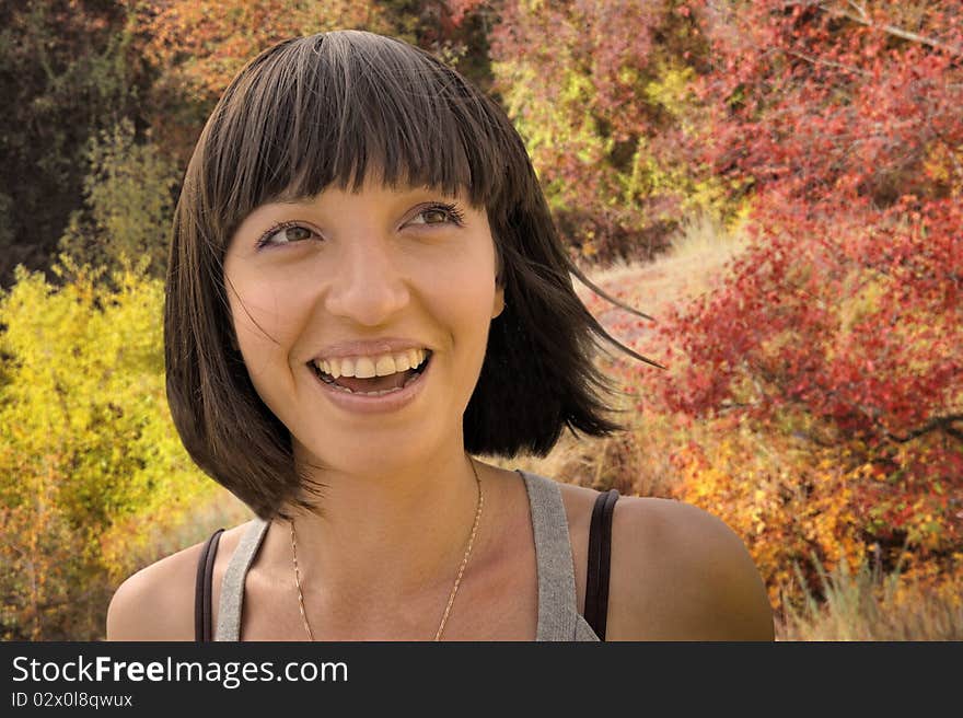 Young pretty woman at the autumn park