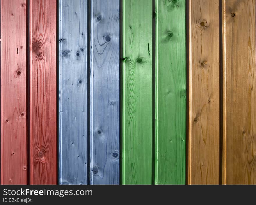 Wall of pine multicolor wood board. Lining closeup, frontally.