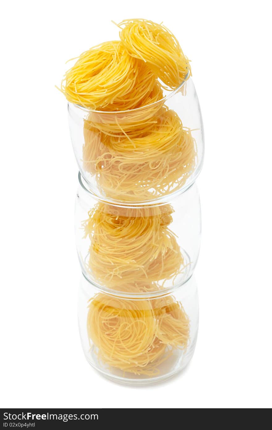 Pasta in glass jar on a white background