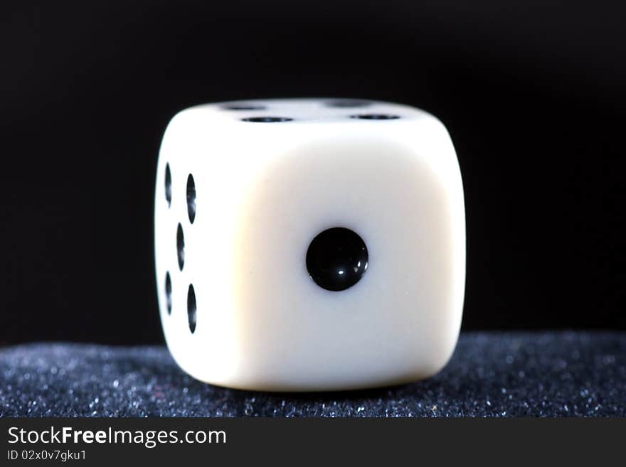 Detail of dice with black background