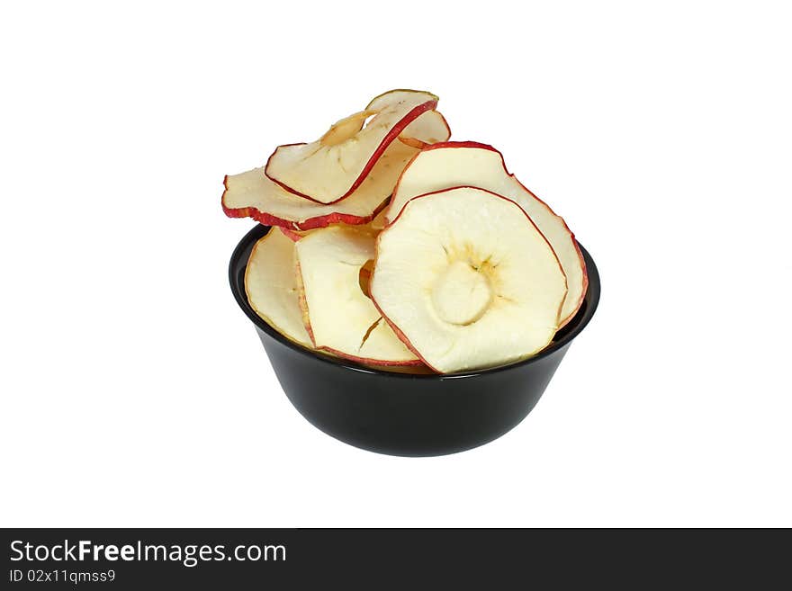 Apple crisp in black bowl isolated on white