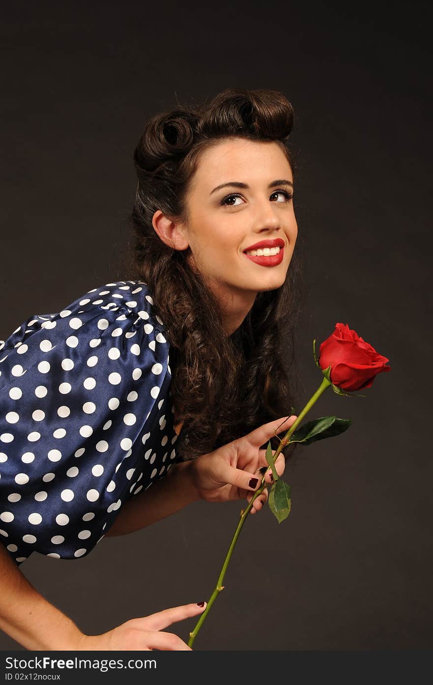 A pretty pin up girl with a rose.