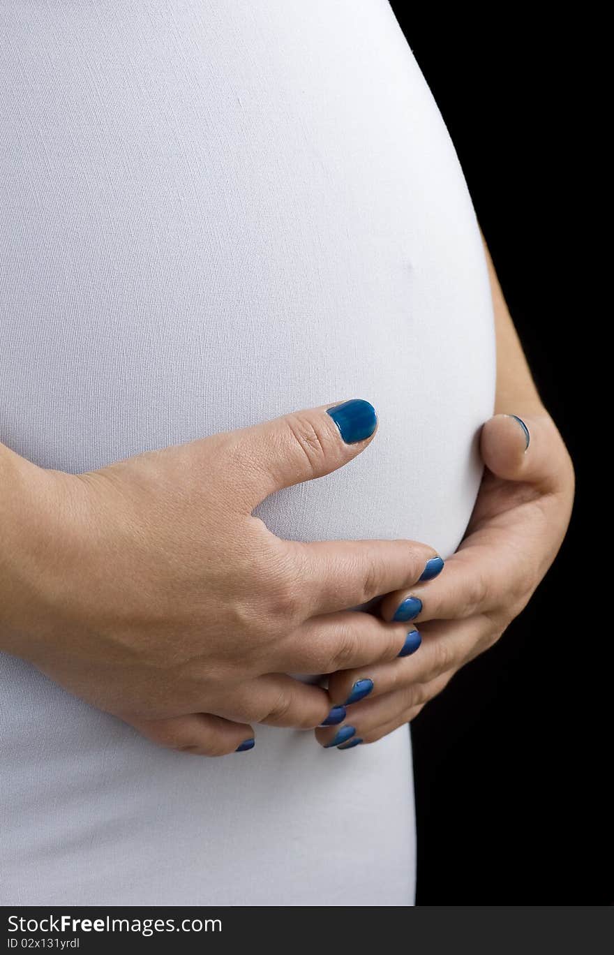 Pregnant woman holding with care belly. Pregnant woman holding with care belly