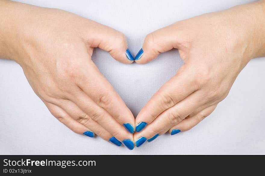 Woman hands - made heart symbol. Woman hands - made heart symbol