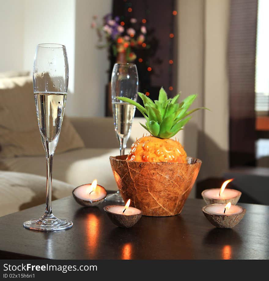 Romantic still-life with wine glasses for champagne and candles. Romantic still-life with wine glasses for champagne and candles