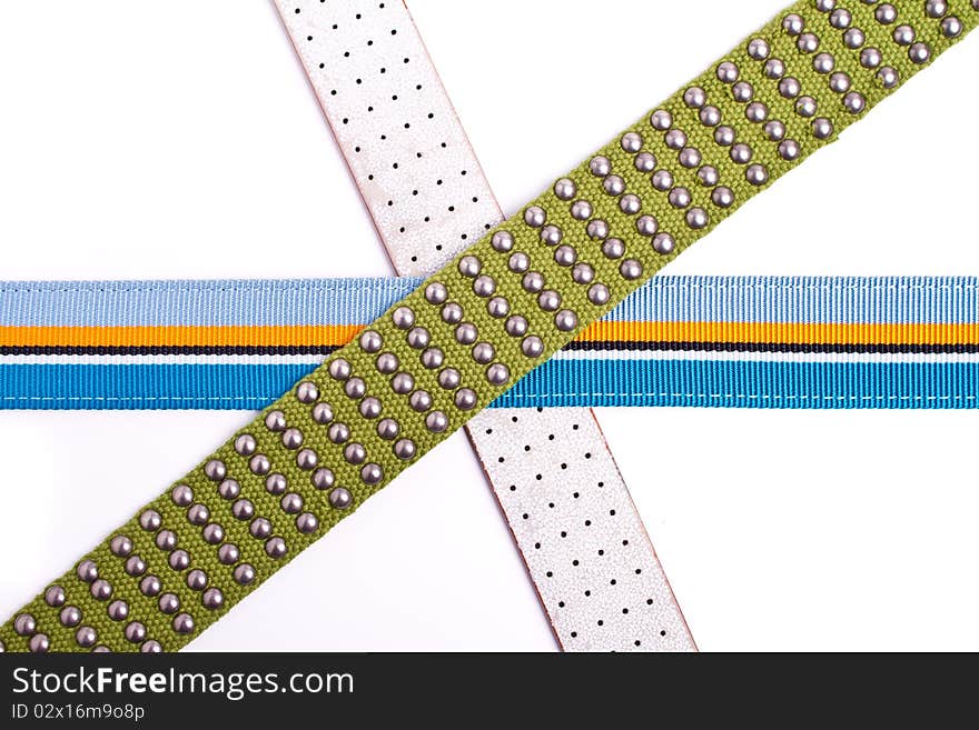 3 belts over white background