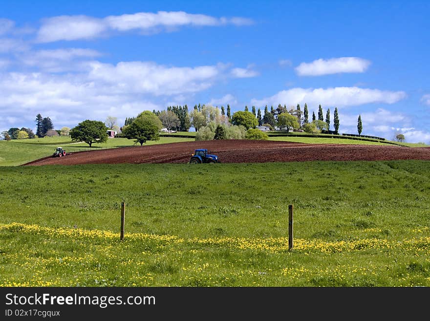 Tractors working on the spring ploughland