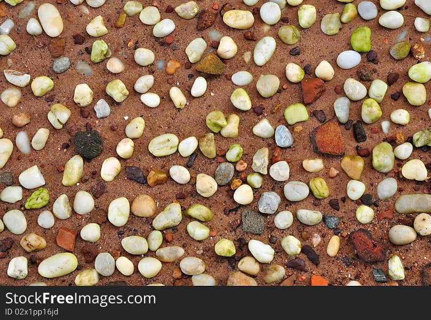 The wet rocks on the sand after the raining showing the refreshing. The wet rocks on the sand after the raining showing the refreshing