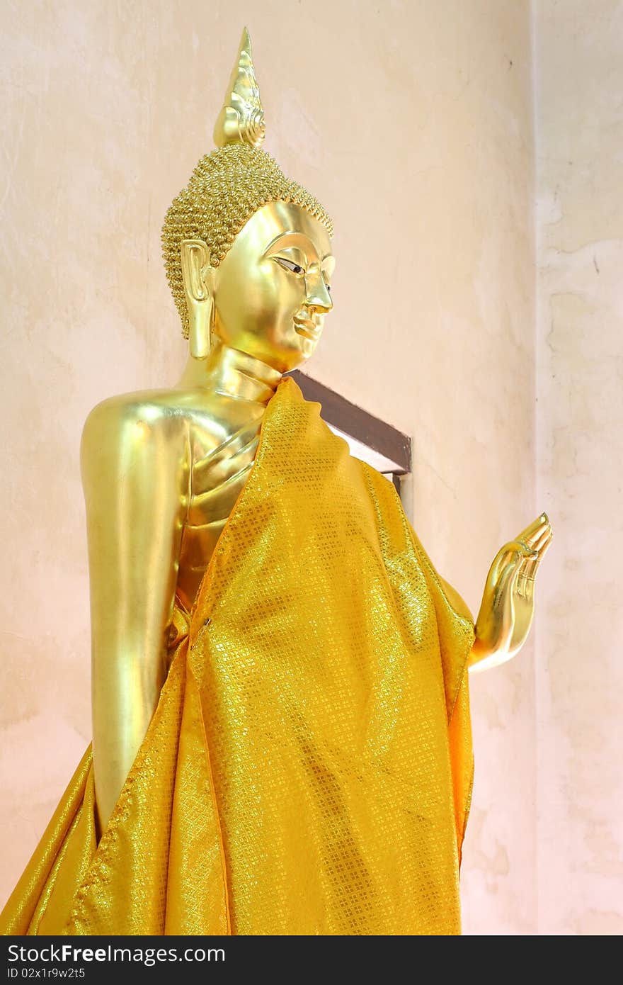 Standing golden Buddha.