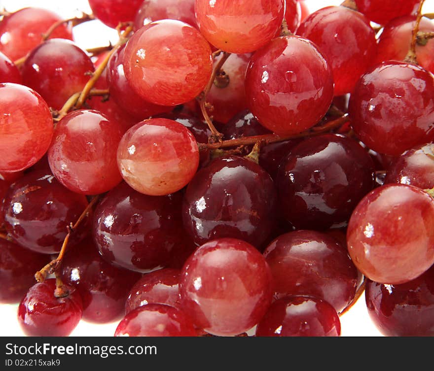 Red grapes on a white background are isolated. Red grapes on a white background are isolated.