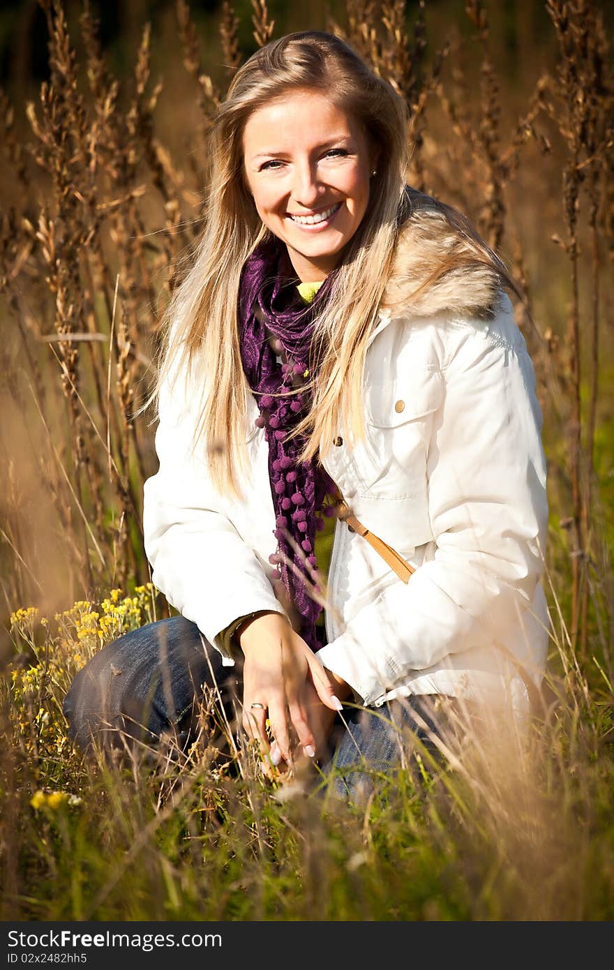 Caucasian young adult blond woman outdoor fall time